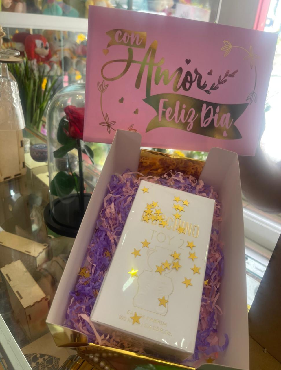 Ancheta con perfume y flores, mensaje Con Amor Feliz Día